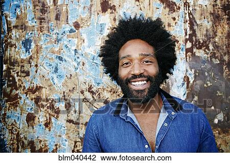 Mixed race man smiling outdoors View Large Photo Image Stock Image - Mixed race man smiling outdoors. Fotosearch