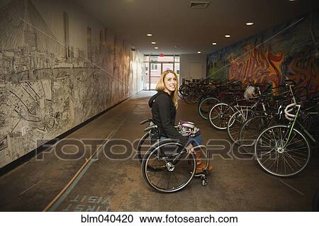 Paraplegic woman sitting in wheelchair View Large Photo Image Stock Image - Paraplegic woman sitting in wheelchair. Fotosearch