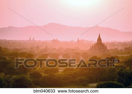 Stock Image - Towers in misty landscape. Fotosearch