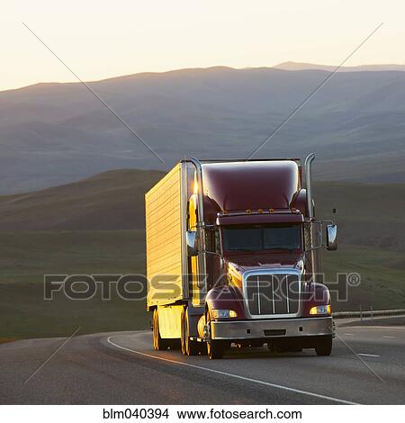 Truck driving on remote highway View Large Photo Image Picture - Truck driving on remote highway. Fotosearch