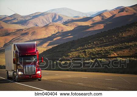 Truck driving on remote highway View Large Photo Image Picture - Truck driving on remote highway. Fotosearch