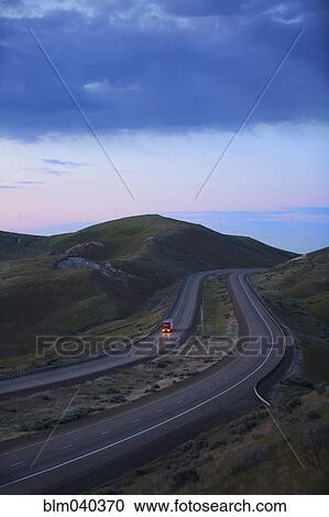 Truck driving on remote highway View Large Photo Image Stock Image - Truck driving on remote highway. Fotosearch
