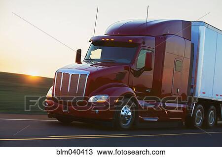 Truck driving on remote highway View Large Photo Image Stock Image - Truck driving on remote highway. Fotosearch