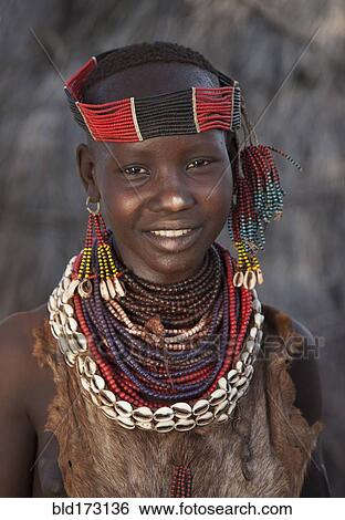 Stock Photograph - Black girl wearing traditional jewelry. Fotosearch