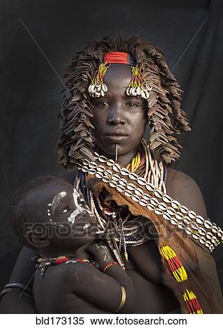 Black mother and daughter wearing traditional jewelry View Large Photo Image Stock Photography - Black mother and daughter wearing traditional jewelry. Fotosearch