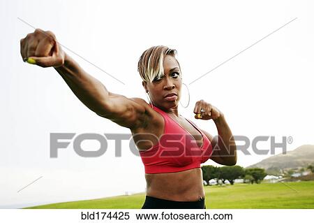 Black woman boxing in field View Large Photo Image Stock Photography - Black woman boxing in field. Fotosearch