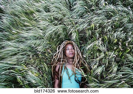 Black woman laying in grass View Large Photo Image Stock Photograph - Black woman laying in grass. Fotosearch