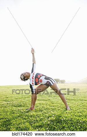 Black woman practicing yoga in field View Large Photo Image Stock Image - Black woman practicing yoga in field. Fotosearch