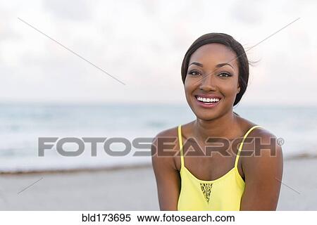 Black woman smiling on beach View Large Photo Image Stock Photography - Black woman smiling on beach. Fotosearch