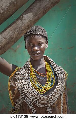 Stock Photo - Black woman wearing traditional jewelry. Fotosearch