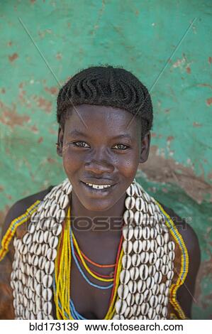 Black woman wearing traditional jewelry View Large Photo Image Stock Photo - Black woman wearing traditional jewelry. Fotosearch