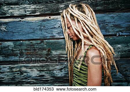Black woman with dreadlocks at wooden wall View Large Photo Image Stock Image - Black woman with dreadlocks at wooden wall. Fotosearch