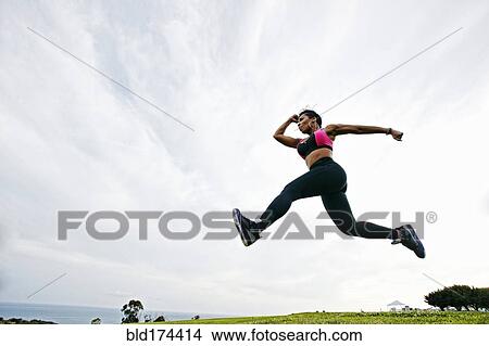 Black woman working out in field View Large Photo Image Picture - Black woman working out in field. Fotosearch