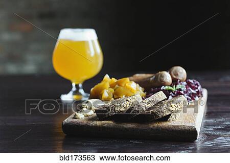 Bread, fruit and cheese on cutting board with beer View Large Photo Image Stock Image - Bread, fruit and cheese on cutting board with beer. Fotosearch