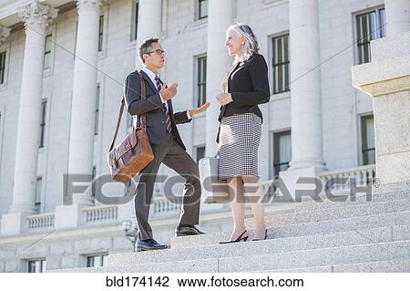 Business people talking on courthouse steps View Large Photo Image Stock Image - Business people talking on courthouse steps. Fotosearch