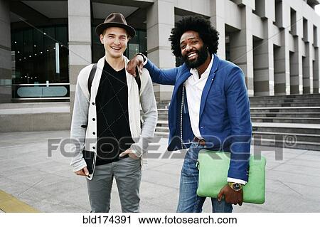 Businessmen smiling in courtyard View Large Photo Image Stock Image - Businessmen smiling in courtyard. Fotosearch