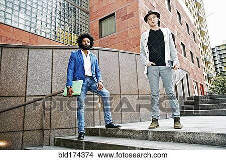 Businessmen standing on steps View Large Photo Image Picture - Businessmen standing on steps. Fotosearch