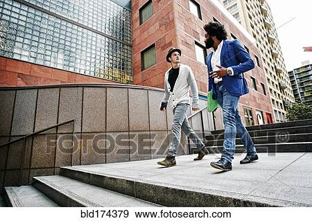 Businessmen talking on steps View Large Photo Image Stock Photo - Businessmen talking on steps. Fotosearch