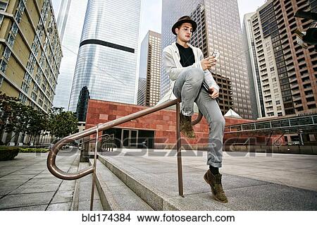 Picture - Caucasian businessman using cell phone . Fotosearch