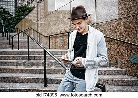 Caucasian businessman using digital tablet View Large Photo Image Stock Photograph - Caucasian businessman using digital tablet. Fotosearch