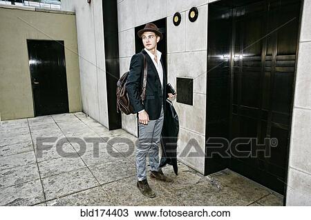 Caucasian businessman waiting for elevator View Large Photo Image Stock Image - Caucasian businessman waiting for elevator. Fotosearch