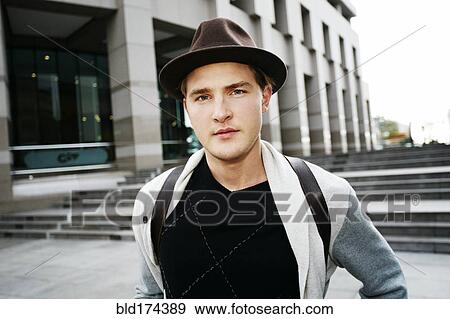 Stock Photo - Caucasian businessman walking outdoors. Fotosearch