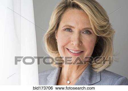 Stock Photograph - Caucasian businesswoman smiling. Fotosearch