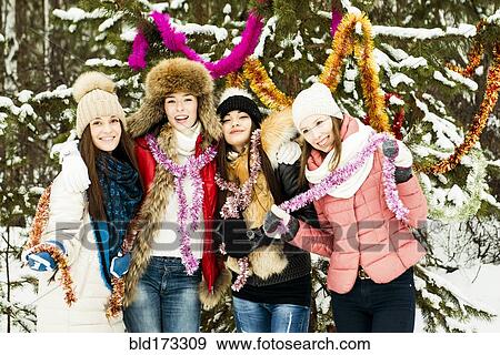 Stock Photo - Caucasian girls playing in snow. Fotosearch