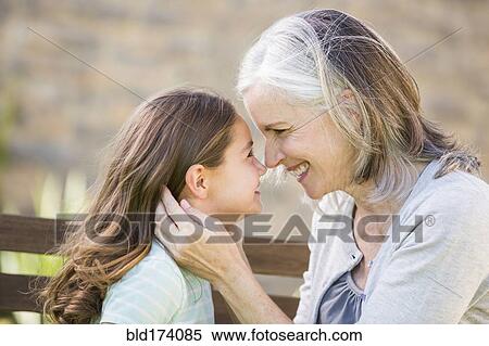 Caucasian grandmother and granddaughter touching noses View Large Photo Image Stock Photography - Caucasian grandmother and granddaughter touching noses. Fotosearch