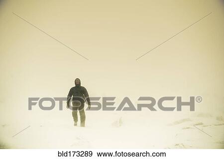 Caucasian hiker walking in snow View Large Photo Image Stock Photo - Caucasian hiker walking in snow. Fotosearch