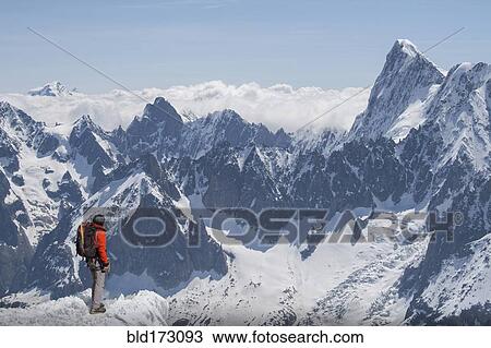 Stock Image - Caucasian skier on mountaintop, Mont Blanc, Chamonix, France. Fotosearch