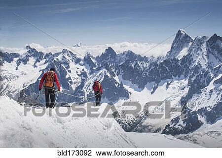 Caucasian skiers walking on mountaintop, Mont Blanc, Chamonix, France View Large Photo Image Stock Image - Caucasian skiers walking on mountaintop, Mont Blanc, Chamonix, France. Fotosearch
