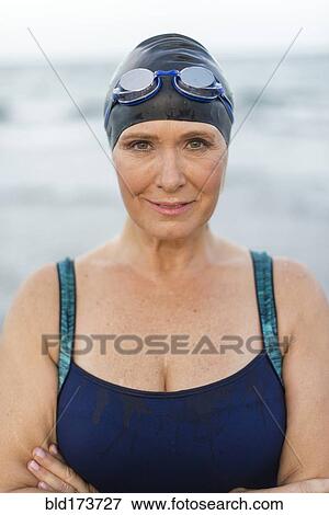 Stock Photo - Caucasian swimmer on beach. Fotosearch