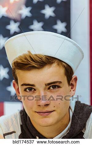 Caucasian teenage boy wearing sailor hat View Large Photo Image Stock Photo - Caucasian teenage boy wearing sailor hat. Fotosearch