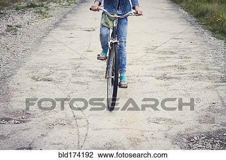 Caucasian teenage girl riding bicycle View Large Photo Image Stock Image - Caucasian teenage girl riding bicycle. Fotosearch