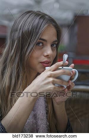 Caucasian woman drinking coffee View Large Photo Image Stock Photo - Caucasian woman drinking coffee. Fotosearch