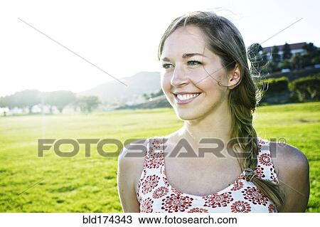Stock Image - Caucasian woman in field. Fotosearch