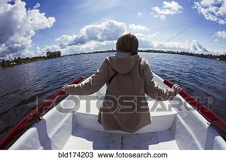 Caucasian woman rowing boat View Large Photo Image Stock Image - Caucasian woman rowing boat. Fotosearch