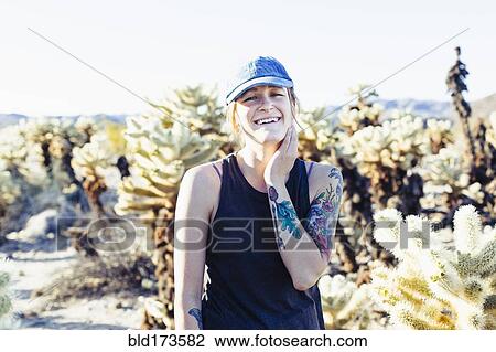Caucasian woman smiling in desert field View Large Photo Image Stock Image - Caucasian woman smiling in desert field. Fotosearch