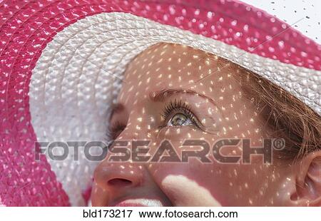 Caucasian woman wearing sun hat View Large Photo Image Stock Photo - Caucasian woman wearing sun hat. Fotosearch