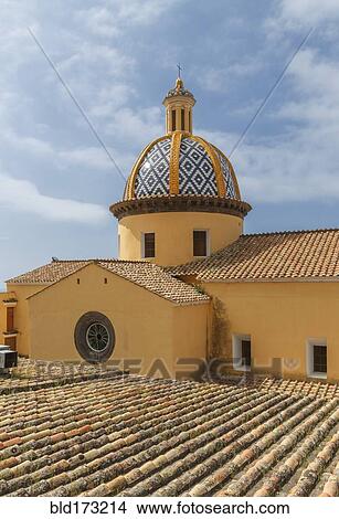 Picture - Church dome and roof under cloudy sky. Fotosearch