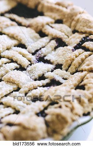 Stock Photograph - Close up of blueberry pie with lattice crust. Fotosearch