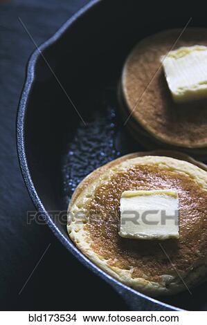 Close up of butter on pancakes in pan View Large Photo Image Picture - Close up of butter on pancakes in pan. Fotosearch