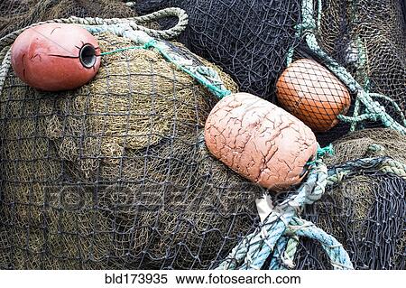 Stock Photography - Close up of fishing net and buoys. Fotosearch