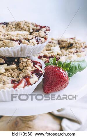 Stock Image - Close up of homemade strawberry pies. Fotosearch