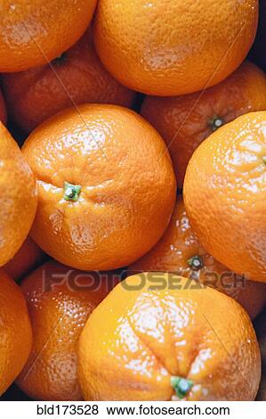 Stock Photo - Close up of pile of oranges. Fotosearch
