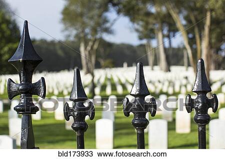 Close up of wrought iron fence around cemetery View Large Photo Image Stock Image - Close up of wrought iron fence around cemetery. Fotosearch