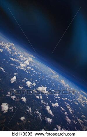 Stock Image - Clouds in Earth atmosphere viewed from space. Fotosearch