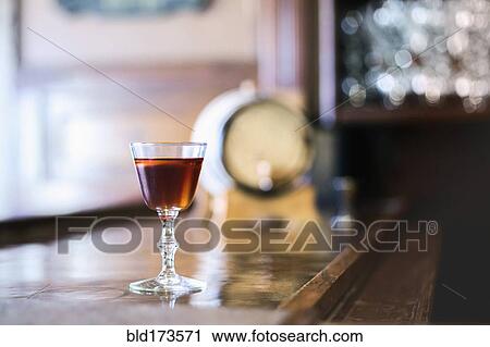 Cocktail glass on bar counter View Large Photo Image Stock Image - Cocktail glass on bar counter. Fotosearch