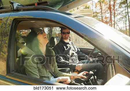 Stock Image - Couple driving in car. Fotosearch